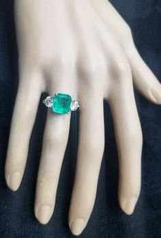 GORGEOUS vintage platinum  engagement ring gem natural green emerald in emerald shape Center emerald weight 3.68ct. size 10.1x8.9mmgorgeous green  color nice luster very lively ,brilliant spakly and clean. side two natural diamonds total weight 1.49ct. Size 5.7mm J -SI1 ring size 6Resizable Appraisal available Retail value $16,500 net. Silver Emerald Ring With Cushion Cut, Asscher Cut Emerald Ring With Vvs Clarity, Green Three Stone Emerald Cut Emerald Ring, Green Emerald Cut Three Stone Emerald Ring, Emerald Asscher Cut Ring, Emerald Cut Three Stone Emerald Ring, Emerald Cut Emerald Ring With Vvs Clarity, Emerald Asscher Cut Ring With Vvs Clarity, Asscher Cut Emerald Ring