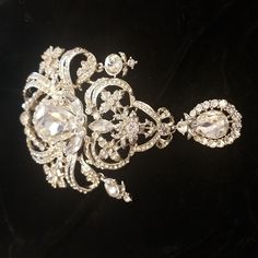 This Amazing Brooch Would Make A Dazzling Focal Point For Any Special Occasion Garment. Perhaps Even A Piece To Bustle A Wedding Gown. It Measures 5" X 3" And Has 3 Dangling Pieces And Enter Pear Shaped Stone That Is Over An Inch Long. The Other Fabulous Thing About This Brooch Is That It Also Has A Loop On The Back To Convert It To A Pendant!!! More Bling For The Buck! Rhinestone Brooches, Wedding Gown, Pear Shaped, Focal Point, A Wedding, Wedding Gowns, Pear, Special Occasion, Womens Sizes