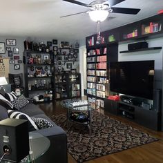 a living room filled with furniture and a flat screen tv