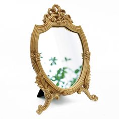 PRICES MAY VARY. Unique gold shield shape frame design，very decorative and functional，s an excellent choice for Baroque and any other antique decor Small hooks and brackets on the back for easy installation or place on the table. Suitable for living rooms, bedrooms, bathrooms, dining rooms and etc. A great decorative wall mirror or desktop mirror MADE of resin materials，SIZE:8.2W x 13 L No Distortion Mirror - High-quality glass mirror with no deformation, perfect for makeup. Each package include Mirrors For Bedroom, Dresser In Living Room, Desktop Mirror, Gold Shield, Decorative Wall Mirror, Mirror Wall Bedroom, Vintage Mirror Wall, Mirror Makeup, Resin Frame