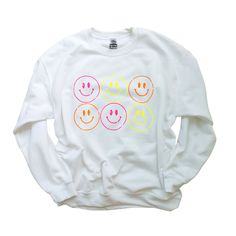 🛒This trendy and comfortable Smiling Face Neon Crewneck Sweatshirt is a great way to express yourself. Wear it as an everyday look or when you want to feel extra happy. It features a preppy, casual design smile design, a crewneck, and smiling faces in neon colors. Super soft, cozy and comfy this oversized sweater is a definite MUST HAVE! 📦 FREE SHIPPING on orders $35 or more to US shoppers 👕Brand = Gildan 🧵Fabric = 50% Cotton / 50% Polyester ✂️Design = Heat-applied neon yellow, neon pink and Cheap Fun T-shirt With Smiley Face, Neon Smiley Face, Neon Sweatshirt, Trendy Crewneck Sweatshirt, Preppy Sweatshirts, Trendy Crewneck, Colorful Sweatshirt, Cheap Sweatshirts, Yellow Neon