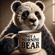 a panda bear holding a coffee mug with the words not a morning bear on it