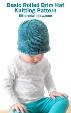 a baby sitting on the floor wearing a knitted hat with text overlay that reads basic rolled brim hat knitting pattern