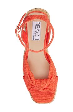 A knotted vamp accent brings modern dimension to a boho-cool sandal lifted by a raffia-wrapped platform and integrated wedge heel. 3" heel; 1" platform Adjustable ankle strap with buckle closure Cushioned footbed with arch support Synthetic upper, lining and sole Imported Orange Sandals With Woven Sole For The Beach, Straw Ankle Strap Espadrilles For Beach Season, Orange Beach Sandals With Woven Sole, Beach Straw Heels, Straw Ankle Strap Espadrilles For Beach, Beach Espadrilles With Ankle Strap In Straw, Beach Platform Heels Made Of Espadrille, Straw Espadrilles With Ankle Strap For Beach, Platform Heels For Beach Season