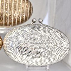 "Heart- stoppingly beautiful design and sparkle! These Evening Formal Oval shaped Purses in gold, gold with pearls and ALL CLEAR will be the talk of town!! Each is handmade. Each takes months to complete, one crystals at a time! Here at Etsy, we offer you the best quality at discounted prices, a fraction of what high priced retailers charge! These are evening bags that are fully covered in genuine, very fine, small sized Swarovski Crystals from Austria! One purse is in all CLEAR CRYSTALS, One is Elegant Crystal Evening Bag With Bling, Elegant Crystal Clutch With Bling, Elegant Evening Bag With Crystal Bling, Elegant Sparkling Crystal Evening Bag, Elegant Bling Evening Bag, Crystal Evening Bag With Bling For Formal Occasions, Formal Crystal Evening Bag With Bling, Elegant Crystal Clutch For Formal Occasions, Elegant Evening Bag With Bling For Formal Events