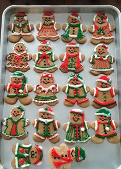 a pan filled with lots of decorated cookies