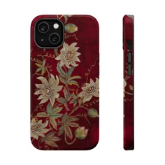 a red phone case with flowers and leaves painted on the front, side and back sides