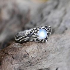 - Fine silver - Natural stones- Made by hands- Great attention to details- Express worldwide delivery- Lifetime warrantyRainbow moonstone ring "Summer" is made out of sterling silver 925. There are beautiful twig texture, detailed leaves and cute tiny butterfly. We use round high quality natural rainbow moonstone cabochon with blue shining for the ring. Every step is made by hands so we do all best to make every detail of the ring really perfect. Metal: 925 Sterling Silver Stone: Natural Rainbow Nature-inspired Moonstone Ring, Nature-inspired Sterling Silver Moonstone Promise Ring, Silver Nature-inspired Moonstone Promise Ring, Nature-inspired Silver Moonstone Promise Ring, Nature-inspired Silver Moonstone Ring, Handmade Nature-inspired Moonstone Ring, Nature-inspired Moonstone Ring For Gift, Nature-inspired Moonstone Ring As Gift, Diamond Birthstone Ring