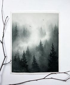 a black and white photo of trees in the fog with birds flying over them on a branch