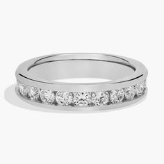 a white gold wedding ring with five stones on the side and four rows of diamonds