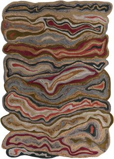 a multicolored rug with wavy lines on it