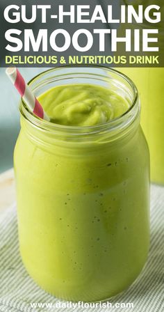 a green smoothie in a mason jar with a straw and text overlay that reads gut - healing smoothie delicious & nutritious drink