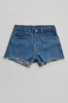 A classic pair of vintage Levi Strauss & Co red tab cut-off denim shorts in a perfect faded retro blue. This pair is in good condition except unfortunately, the red tab at the back pocket has been cut off and there are small burgundy dot marks at the interior of body (not visible on the exterior and only in a small area towards the bottom cut edge). The back denim patch has been stamped with "irregular" but the 5 button fly jean shorts fit great. Details: Vintage denim cut-off shorts (good condi Retro Medium Wash High-waisted Jean Shorts, Retro High-waisted Jean Shorts In Medium Wash, Retro Light Wash Short Jean Shorts, Retro Light Wash Short Length Jean Shorts, Retro Mid-rise Medium Wash Jean Shorts, Retro Light Wash Jean Shorts, Retro Mid-rise Jean Shorts In Medium Wash, Light Wash Vintage Denim Shorts, Vintage Light Wash Denim Shorts