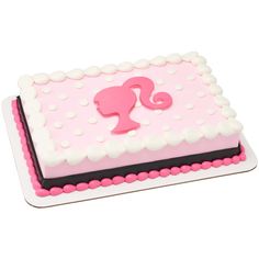 a pink and black cake with white polka dots on the bottom is shaped like a seahorse