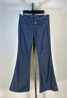 Have you ever wished you could go back in time, just to pick up some fab past fashions? I have. These dreamy denim bell bottoms are in a rare, unworn state still from the 1970's... These pristine condition bell bottoms are made from a dark wash, pure cotton denim (still stiff from dis-use and possibly Sanforized). They feature a rare low rise with button fly front. Two small welt pockets adorn either hip. No back pockets or any other design details to note. There is a 'Lee' label at back right waist, as well as a Union label hidden inside one of the pockets. The overall condition is absolutely brand new, unworn condition with absolutely no flaws to note! Please note: although I always clean all the pieces sold here at Miss Master's Closet, these jeans have not been washed, in order to pres High Rise Medium Wash Cotton Flares, High Rise Cotton Flares In Medium Wash, Mid-rise Medium Wash Cotton Flares, Mid-rise Cotton Flares In Medium Wash, Mid-rise Denim Blue Cotton Flares, Medium Wash Cotton Flare Pants, Medium Wash Cotton Flare Jeans, Medium Wash Cotton Flares, Denim Blue Cotton Straight Leg Flares