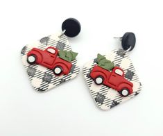 pair of earrings with red car and green leaf decoration