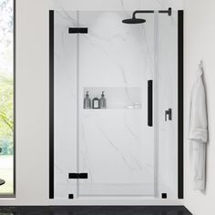 a bathroom with a walk in shower next to a white wall and black trimming