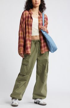 Perfect your '90s grunge aesthetic with an oversized, layer-ready button-up shirt made from lightweight plaid flannel. Front button closure Spread collar Long sleeves with button cuffs 55% cotton, 45% rayon Machine wash, tumble dry Imported Not available for sale and shipment to Germany Flannel Shirt With Cargo Pants, Oversized Plaid Flannel Shirt With Pockets, Trendy Plaid Flannel Shirt With Pockets, Relaxed Fit Flannel Shirt For Fall Streetwear, Relaxed Fit Button-up Flannel Shirt For Streetwear, Relaxed Fit Flannel Shirt For Everyday, Casual Relaxed Fit Flannel Shirt For Everyday, Trendy Relaxed Fit Flannel Shirt With Pockets, Button-up Flannel Shirt With Pockets For Streetwear