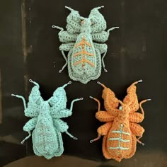 three crocheted bugs sitting next to each other