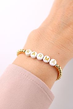 Gold-plated letter bracelet. Bracelet personalized 3mm.  You can personalize this beautiful gold-plated bead bracelet with the text of your choice or the name of your favourite person. You can wear the delicate lucky charm bracelet on its own or combine it with other bracelets. The stones are strung on a stretch band, making the bracelet easy to slip over the hand. ❤ Handmade with love I High-quality I Loving packaging ❤ DETAILS Brass beads 14k gold-plated 3mm Acrylic letter beads 7mm Elastic ny Bracelet Easy, Lucky Charm Bracelet, Arm Jewelry, Acrylic Letters, Letter Bracelet, Brass Beads, Stretch Band, Pretty Jewelry, Stretch Bands