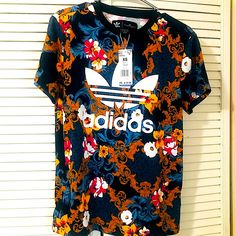 New With Tags Adidas Originals Floral Trefoil Very Oversized Rare Graphic Tee Shirt Size Xs But Will Easy Fit Up To A Large. Trendy Blue Floral Print T-shirt, Adidas Summer T-shirt With Graphic Print, Adidas Graphic Print T-shirt For Summer, Adidas Multicolor Graphic Print Tops, Adidas Multicolor Short Sleeve Tops, Sporty Multicolor Adidas Tops, Adidas Sporty Multicolor Tops, Casual T-shirt With Vibrant Print, Casual T-shirt With Vibrant Print And Short Sleeves