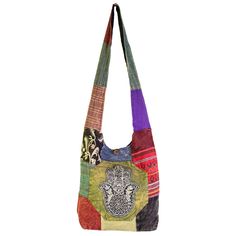 Ward off bad vibes wherever you go with this shoulder bag stitched with an ancient symbol of strength and protection. Patches of boho printed cotton are beautifully constructed into one unique shoulder bag featuring an embroidered Hamsa on the front, a zippered closure with loop and button, a large main compartment with one zippered inner pocket, and a thick strap which can be worn on the shoulder or crossbody. Bohemian Patchwork Cotton Shoulder Bag, Bohemian Cotton Patchwork Shoulder Bag, Bohemian Multicolor Cotton Canvas Bag, Bohemian Cotton Canvas Shoulder Bag, Bohemian Cotton Shoulder Bag For Travel, Hippie Cotton Shoulder Bag For Travel, Festival Cotton Tote Shoulder Bag, Bohemian Cotton Bag With Adjustable Strap, Hippie Cotton Bags For Everyday Use