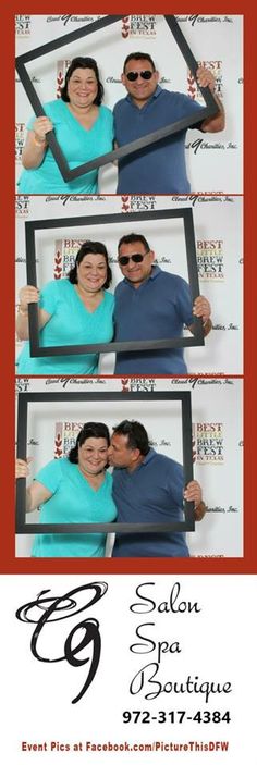 a man and woman posing for a photo booth