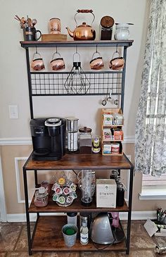 a shelf with pots and pans on top of it