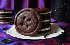 there are some cookies on the plate and one has a hole in it