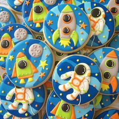 cookies decorated like outer space characters are on display