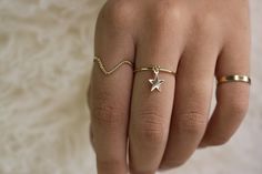 "Make a Wish! Our cute simple band ring with movable star charm is sure to make your wish come true. Great all by its self for a minimal look or stacked with other band rings in your collection. *Model may be shown with this item layered with other items not included in this listing. These items are available and sold separately in our Shop. Links Below. . . . . . . . . . . . . . . . . . . . . . . . . . . . . . . . { D E T A I L S } * Entirely 14kt Gold Filled * Star measures 7mm * Highly polish Minimalist Star-shaped Everyday Jewelry, Minimalist Star-shaped Rings For Everyday, Minimalist Star Shaped Rings For Everyday, Minimalist Star-shaped Midi Rings As Gift, Minimalist Star-shaped Midi Rings For Gifts, Simple Star-shaped Jewelry With Star Charm, Charm Ring, Simple Band, Stack Ring