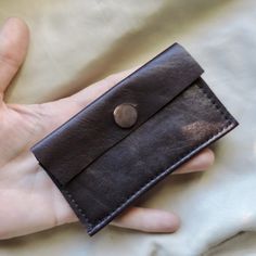 brown leather mother of pearl shell button wallet - simple leather wallet - handmade leather wallet with button closure - sturdy minimal wallet - over 10 years ago I searched for a simple wallet without success so I decided to make the perfect wallet - using up-cycled leather I sewed together a soft leather wallet - this wallet is a take on that with a leather flap and vintage dark brown mother of pearl abalone shell button closure -  holds money and cards - it stays securely in pocket or purse - perfect size for business cards - measures about 3 by 4 1/2 inches - this brown leather wallet has a smooth suede interior - it fits 3 credit cards, a few business cards, money folded in half, and a license securely and easily - brown leather abalone shell button leather handmade wallet Simple Leather Wallet, Wallet Simple, Folding Money, Minimal Wallet, Simple Wallet, Minimalist Leather Wallet, Wallet Minimalist, Brown Leather Wallet, Handmade Wallets