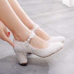 Popular elements: lace, beads, flowersToe shape: round headMaterial: PUHeel height: high heels (6-8CM)Color: whiteSizes: 34,35,36,37,38,39,40,41,42,43Material: rubber soleMaterial: imitation leatherUpper height: low topHeel shape: thick heelTechnology: viscose shoes Flower Wedding Shoes, Wedding Toes, Thick Heel Shoes, High Heel Dress Shoes, Wedding Pumps, White High Heels, White Wedding Shoes, Wedding Shoes Heels, Heels Platform