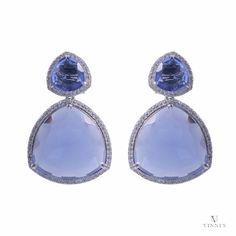 Step into the glow of elegance with our Lavender Luminescence Earrings, a pair that's as unique as you are. Meticulously handcrafted with a harmonious blend of polished brass alloy and sterling silver, these earrings are adorned with the mesmerizing sparkle of lavender moissanite stones. Designed to catch the light and the eyes of onlookers at any cocktail party, these earrings are the epitome of chic sophistication. Each moissanite gem is carefully selected for its exceptional clarity and capti Luxury Lavender Earrings For Formal Events, Luxury Light Blue Jewelry For Wedding, Luxury Elegant Light Blue Jewelry, Luxury Light Blue Elegant Jewelry, Luxury Lavender Earrings For Gifts, Luxury Lavender Earrings As Gift, Lavender Earrings, Dazzling Earrings, Earrings Luxury