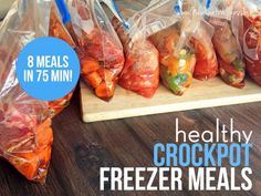 there are several bags of frozen meats on the table with text overlay that says healthy crockpot freezer meals