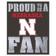 a sign that says proud to be a nebraska fan