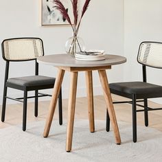 a small table with two chairs around it