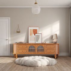 a living room with an animal skin rug on the floor and a wooden entertainment center