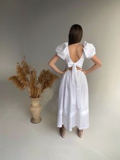 This pinafore linen dress features bow on the back with puffy sleeves. Mid-calf length. Boho linen dress  is just perfect for wedding, birthday outfit and for photoshoot. The model is 168 cm/ 66,15 inches height and is wearing size S.  Our sizing based full height (from the head top to heels). Please check the size chart before you place your order. The size chart is the picture of the listing. ✅ Materials:  linen (flax) - Oeko-tex 100 certified. ✅ Processing time: 1-3 business days. ✅ Recommend Elegant Summer Puff Sleeve Dress With Tie Back, Puff Sleeve Dress With Tie Back For Brunch, Puff Sleeve Dresses With Tie Back For Brunch, Elegant Linen Dress With Ruffles For Brunch, Chic Linen Puff Sleeve Dress For Brunch, Puff Sleeve Midi Dress With Tie Back For Brunch, Elegant Puff Sleeve Dress With Tie Back, White Puff Sleeve Dress With Tie Back For Brunch, Elegant Linen Puff Sleeve Dress For Brunch