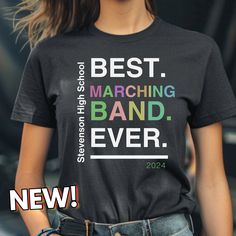 Are you looking for college or high school band shirts? You'll love this Customized Best Marching Band Ever T-Shirt.  Give us the School Name, and Color choice for the design (if you have a preference) and we will send a mock-up for approval before ordering. After approval, shirts should process and deliver in 7-10 business days. Questions about the design or options? Message us on Etsy or email support@chordchic.com before placing your order! T-shirts Color Options: Black, Heather Purple, Dark College Band Merch T-shirt With Letter Print, Fan Apparel T-shirt With Letter Print For Concert, Black Band Merch T-shirt For College, Band Merch Cotton Tops For School, Cotton Band Merch Tops For School, School Cotton Tops With Band Merch Style, School Tops In Cotton With Band Merch Style, School Band Shirts, Band Merch Ideas