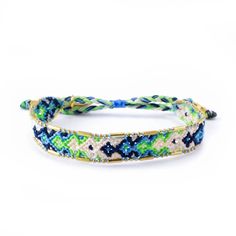 two bracelets with blue, green and white beads on each one stranded together