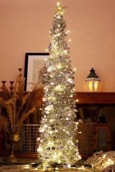 a white christmas tree with lights on it