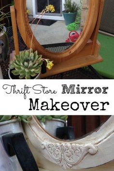 a mirror sitting on top of a table next to a potted succulent