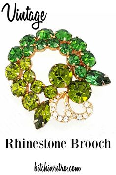 Sparkly vintage rhinestone pin in beautiful shades of green. The colors, circular shape and trailing clear rhinestone curlicues are reminiscent of a mid century modern holiday wreath.   #vintage #vintagejewelry #green #wreaths #vintagestyle #bitchinretro #rhinestone #giftideas Small Holiday Gift Ideas, Gift Ideas For Mothers Day, Ideas For Mothers Day, Vintage Rhinestone Jewelry, Vintage Rhinestone Brooch, Fur Coat Vintage, Vintage Inspired Jewelry, Jewellery Gifts, Vintage Fur