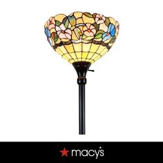 a lamp that is sitting on top of a pole with the words macy's above it