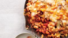 a casserole dish with meat, cheese and sauce