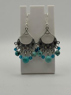 Beautiful turquoise and crystal dangle Earrings. Made with sterling silver earwire and comes with earring backs. Be sure to check out the matching necklace and bracelet! I take pride in my work so if there are ever any problems with this piece, please let me know so we can get it fixed! I make one of a kind jewelry that will stand out! Will ship Quickly!! Turquoise Teardrop Chandelier Earrings In Sterling Silver, Czech Glass Dangle Jewelry With Matching Earrings, Sterling Silver Beaded Earrings For Jewelry Making, Czech Glass Jewelry With Matching Dangle Earrings, Nickel-free Teardrop Czech Glass Jewelry, Hypoallergenic Czech Glass Teardrop Jewelry, Turquoise Beaded Dangle Earrings For Gift, Turquoise Dangle Beaded Earrings For Gift, Turquoise Earrings With Dangling Beads For Gift