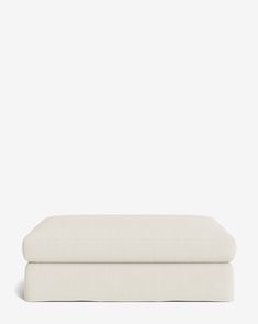 two white pillows sitting on top of each other