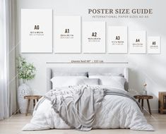 a poster size guide on the wall next to a bed with white sheets and pillows