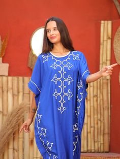 An elegant Moroccan caftan will make you feel like African royalty. It's extremely elegant with a dash of classy cotton embroidery in the front. Ideal for plus size women as well. Made of extremely soft fabric to make you feel free and beautiful at the same time.  This Kaftan is ideal to wear for any casual occasion. Whether taking a trip down the shopping lane, or home-based kitty parties, or about anything else, wearing this dress will make you feel classy and comfortable. Fabric : 70% Egyptia Oversized Tunic Abaya, Bohemian Tunic Thobe, Free Size Tunic Abaya, Summer Oversized Abaya, Traditional Oversized Kaftan With Kimono Sleeves, Long Embroidered Free Size Kaftan, Free Size Embroidered Tunic Kaftan, Long Embroidered Free-size Kaftan, Blue Oversized Kaftan For Festivals